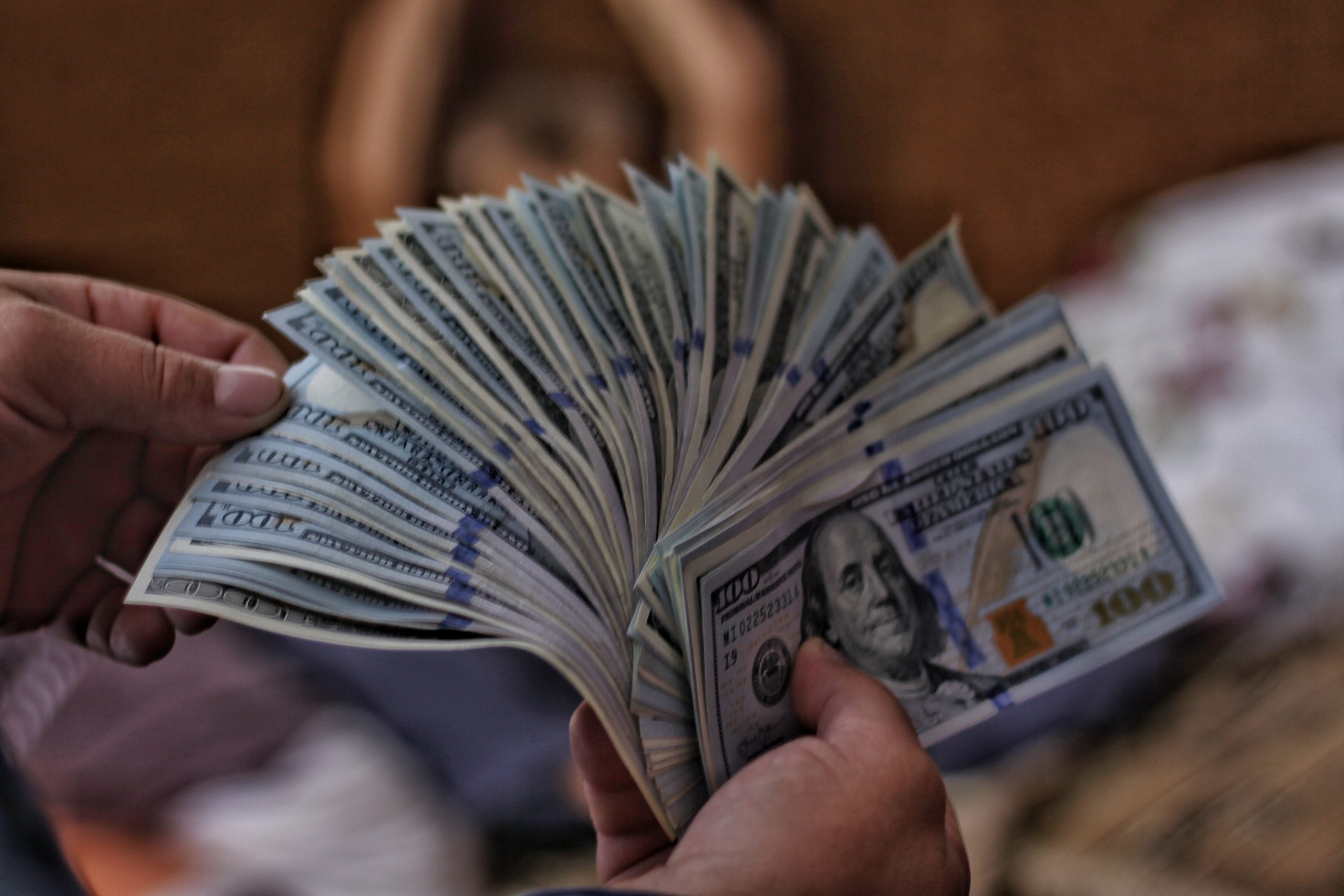 hand holding dollars